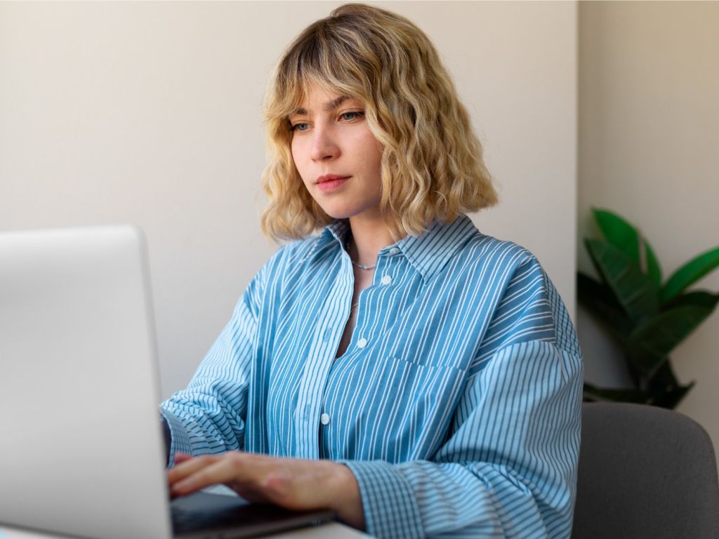 Student checking her laptop